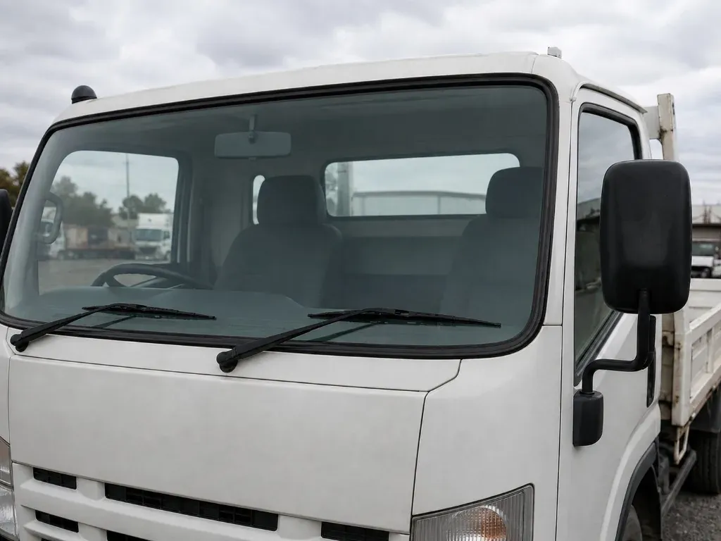 After: white truck with a newly fitted clear front windscreen