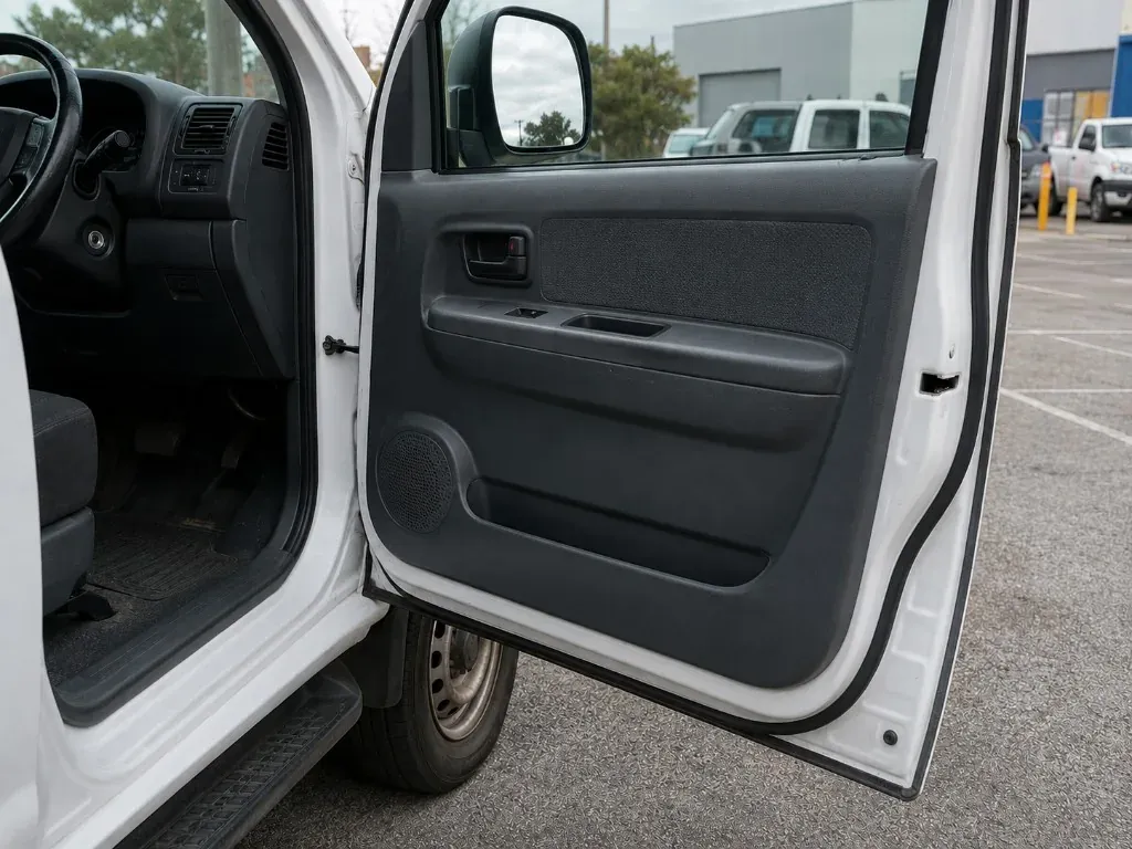 After: vehicle door refitted with the trim panel and power window switch back in place