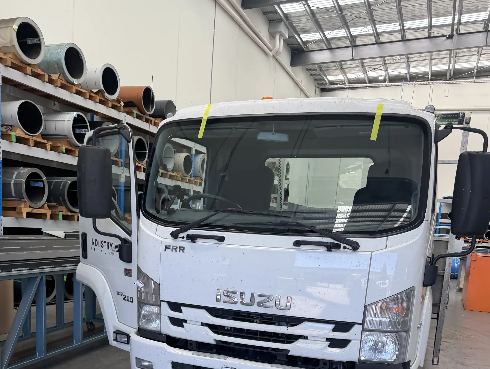 Isuzu truck with a newly fitted windscreen taped in place during a mobile replacement in Melbourne